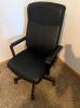 Black padded office swivel chair